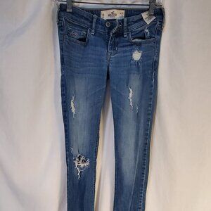 Hollister, distressed low rise jeans size 0R (w24 L33) Mid wash.